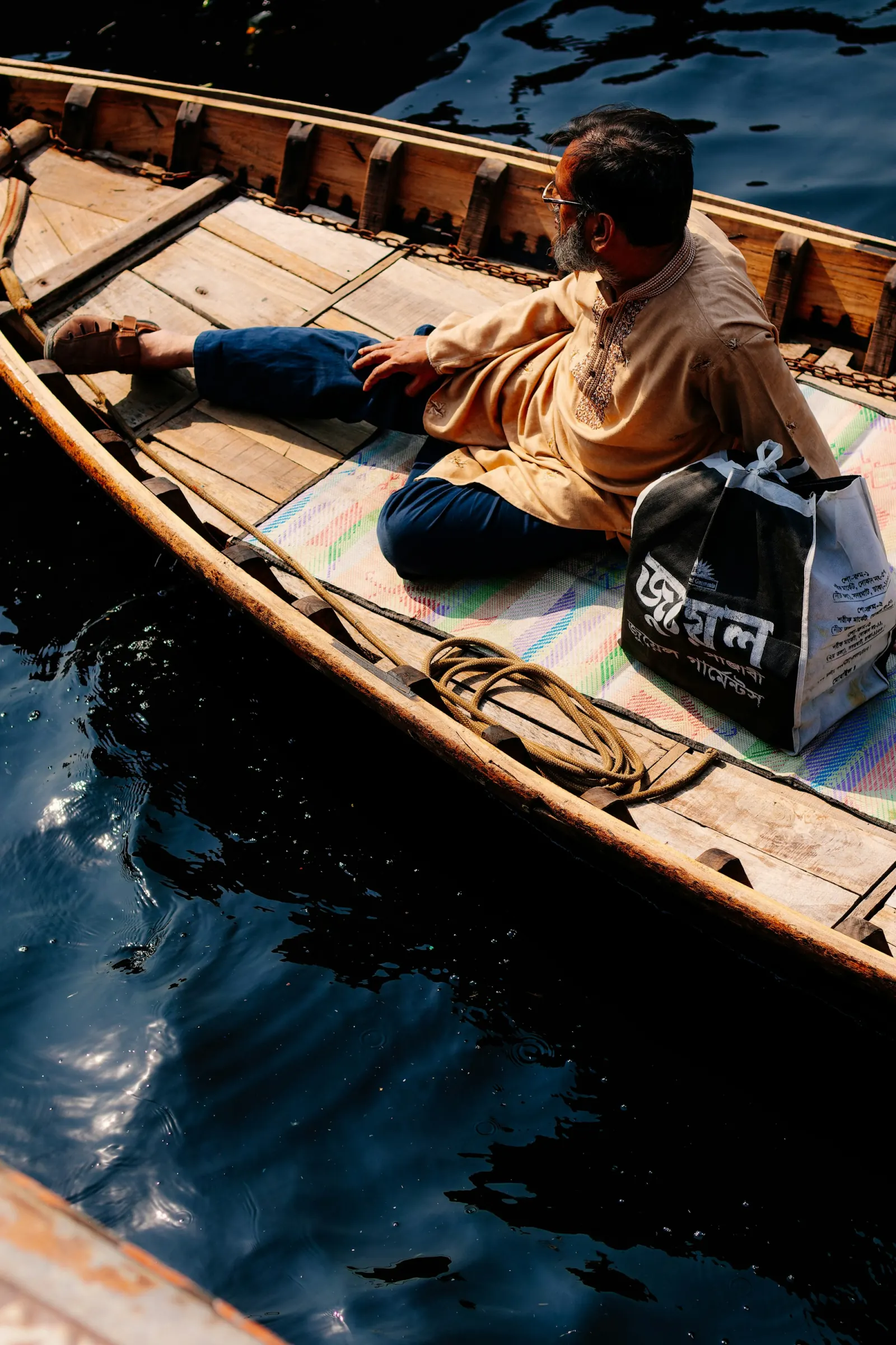 Boatman on the Buriganga River at Sadarghat in Dhaka, regional travel context for Buriganga River
