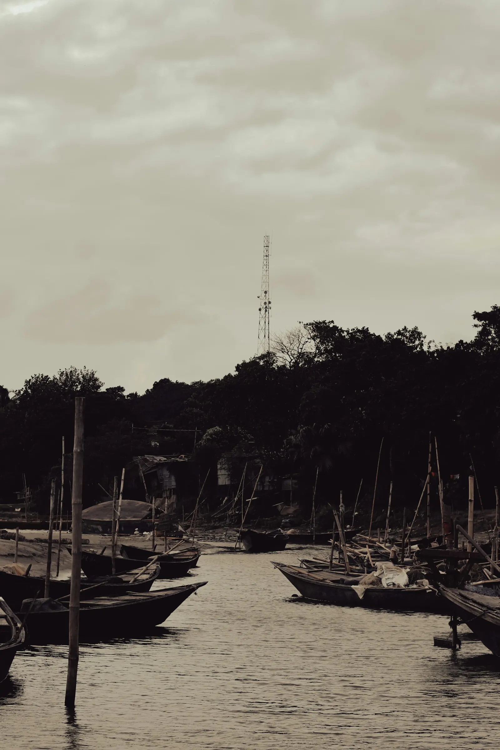 Traditional boats gathered on the Padma River at Rajshahi, regional travel context for Puthia Temple Complex