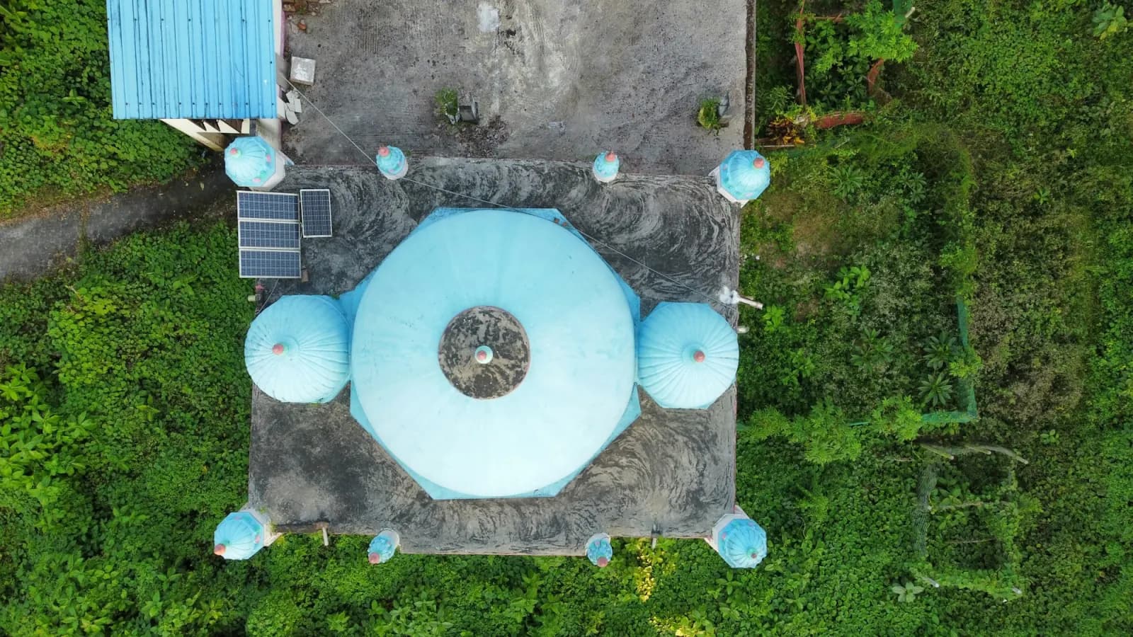 Aerial view of a historic three-domed mosque in Chattogram during the Chittagong Shipyard Tour